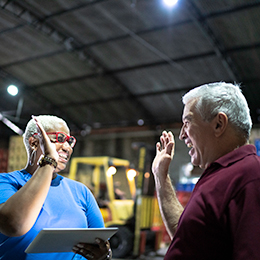 Two workers about to high five